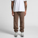 Brown track pants with a relaxed fit and an elastic waistband, paired with grey sneakers. The model wears a plain white t-shirt. Brown track pants with a relaxed fit and an elastic waistband, paired with grey sneakers. The model wears a plain white t-shirt.
