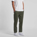 Straight pants in olive green displayed on a model, paired with a white t-shirt and white sneakers.