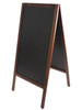 A wooden A-frame chalkboard with a black surface, designed for displaying messages or promotions. A wooden A-frame chalkboard with a black surface, designed for displaying messages or promotions.