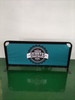 A freestanding café barrier with a teal fabric and a black frame featuring a logo in the centre.