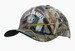 A camouflage cap featuring a full brim and a logo, predominantly in earthy tones of green, brown, and tan. A camouflage cap featuring a full brim and a logo, predominantly in earthy tones of green, brown, and tan.