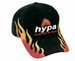 A black cap with double flame designs in red and yellow, featuring a logo on the front.