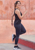 Womens Luna 7/8 length leggings in navy, paired with a black tank top and black sneakers, feature a logo. Womens Luna 7/8 length leggings in navy, paired with a black tank top and black sneakers, feature a logo.