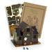 A wooden model of a haunted house in dark colours, featuring a ghost and pumpkins, with assembly instructions.