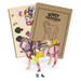 A wooden model of a sheep in vibrant colours, displayed with its packaging and craft supplies for assembly.