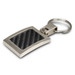 A silver key ring with a carbon-fibre textured panel and a logo. The design is sleek and modern. A silver key ring with a carbon-fibre textured panel and a logo. The design is sleek and modern.