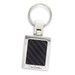 A silver key ring with a rectangular carbon fibre insert and a logo. The key ring features a polished finish. A silver key ring with a rectangular carbon fibre insert and a logo. The key ring features a polished finish.