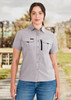 A light grey women's outdoor short sleeve shirt with chest pockets and a zipper pocket, featuring a logo. A light grey women's outdoor short sleeve shirt with chest pockets and a zipper pocket, featuring a logo.