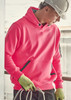 A bright pink unisex water-resistant hoodie with a front pocket and a logo, worn by a person with a hard hat and gloves.