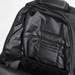 A black backpack interior featuring multiple pockets and compartments for organisation. A black backpack interior featuring multiple pockets and compartments for organisation.