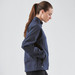 A navy women's Cirrus Bonded Jacket with a high collar and zippered pockets, featuring a logo.