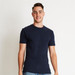 A navy blue men's cotton crew t-shirt displayed on a model against a simple background, featuring a logo on the shirt.