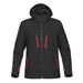 A black softshell jacket with red zippers and a hood, featuring a logo on the sleeve.