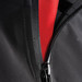 A black softshell jacket featuring a contrasting red interior and a zip closure, with a logo present.