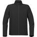 A black softshell jacket with a zippered front, high collar, and two side pockets. Features a logo on the lower front. A black softshell jacket with a zippered front, high collar, and two side pockets. Features a logo on the lower front.