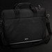 A black laptop bag with dual handles, an adjustable strap, and a logo on the front. A black laptop bag with dual handles, an adjustable strap, and a logo on the front.