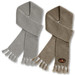A pair of Ruga Knit Scarves in light grey and olive green, featuring a branded logo and fringed ends.