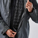 A grey men's jacket with a zippered front, featuring a quilted black lining and a person holding it open.