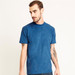 A men's crew-neck t-shirt in a vibrant blue hue, featuring short sleeves and a casual fit. It has a logo.