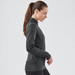 A women's black thermal 1/4 zip jumper, featuring a fitted design and long sleeves, with a logo on the hem.