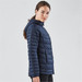 A navy women's thermal jacket featuring a hood and quilted design, with a branded logo on the side.
