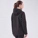 A black women's softshell jacket with a hood, displayed from the back. It features a logo on the sleeve.