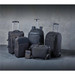 A collection of black bags, including backpacks, a wheeled suitcase, and a messenger bag, with a sleek design.