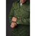 A green quilted jacket with a button-up front and chest pockets, featuring a logo on the upper left. A green quilted jacket with a button-up front and chest pockets, featuring a logo on the upper left.