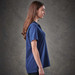 A women's navy polo shirt with a classic fit and short sleeves. Features a logo on the chest.