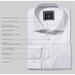 A folded white button-up shirt featuring a hidden button-down collar, cuff links, and a tag with branding. A folded white button-up shirt featuring a hidden button-down collar, cuff links, and a tag with branding.