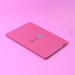 A pink A5 notebook with a logo on the cover, featuring a matching elastic band closure.