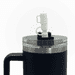 A drink bottle featuring a black exterior, clear lid, and a white nozzle, along with a handle and logo. A drink bottle featuring a black exterior, clear lid, and a white nozzle, along with a handle and logo.