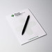 A5 notepad with 25 leaves, featuring a white background and a black pen, includes a logo at the top. A5 notepad with 25 leaves, featuring a white background and a black pen, includes a logo at the top.