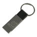 A black leather keychain with a silver metal rectangular attachment and a logo.