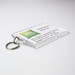 A clear hotel keychain with a keyring, featuring a logo. The background is predominantly white with green accents. A clear hotel keychain with a keyring, featuring a logo. The background is predominantly white with green accents.