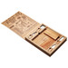 A wooden cheeseboard and knife set featuring various utensils and a decorative engraved lid. It has a logo.