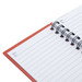 A notepad featuring blank lined pages, with a spiral binding and an orange cover. It also has a logo on the front. A notepad featuring blank lined pages, with a spiral binding and an orange cover. It also has a logo on the front.