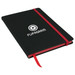 A black A5 journal with a red elastic band and ribbon bookmark, featuring a logo on the cover.