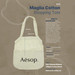 A cotton shopping tote in cream with mesh panels and a logo, featuring sturdy handles and a spacious interior. A cotton shopping tote in cream with mesh panels and a logo, featuring sturdy handles and a spacious interior.