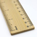 A bamboo ruler featuring a clear measurement scale in inches, showcasing a natural wood finish and a branding logo. A bamboo ruler featuring a clear measurement scale in inches, showcasing a natural wood finish and a branding logo.