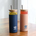 A drink bottle set featuring a navy blue tumbler and a pink tumbler, each with a bamboo lid and straw.