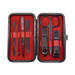 A black manicure set with red lining, containing scissors, clippers, tweezers, and various nail tools, presented in a compact case. A black manicure set with red lining, containing scissors, clippers, tweezers, and various nail tools, presented in a compact case.