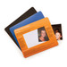 A set of three mouse mats in black, blue, and orange, featuring a photo window on the orange mat. A set of three mouse mats in black, blue, and orange, featuring a photo window on the orange mat.