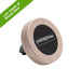 A round car vent mount in beige and black, made from plant fibres, featuring a logo on its surface. A round car vent mount in beige and black, made from plant fibres, featuring a logo on its surface.