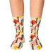Colourful socks featuring various shapes and a logo pattern in hues of yellow, green, red, and orange.