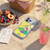 Peanuts Snoopy Aloha Disco Cowabunga! Soft Gel Case for Apple iPhone 17 Pro