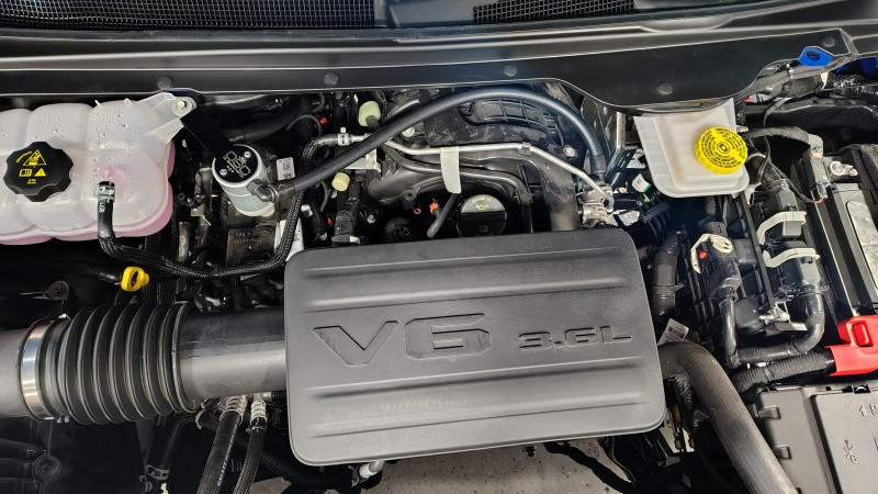 J&L 19-25 Ram 1500 3.6L Oil Separator 3.0 PCV Side -Clear Anodized - 3126P-C Photo - Mounted