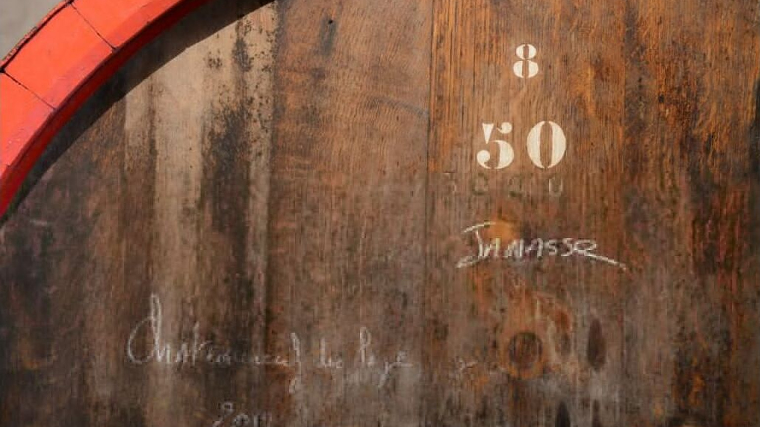 Mature oak cask in the Domaine de la Janasse cellar