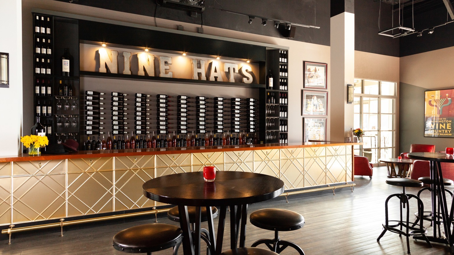 Nine Hats bar with a set table, official producer press
