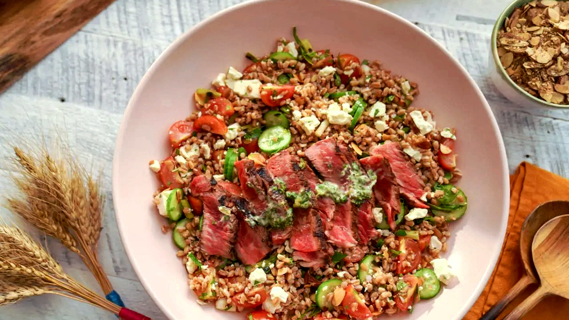 Grilled ribeye on feta farro with garden vegetables